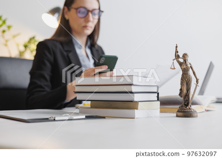 female lawyer in strict suit works in office or court, checks clients' contracts. Caucasian successful business lady, chats by phone 97632097