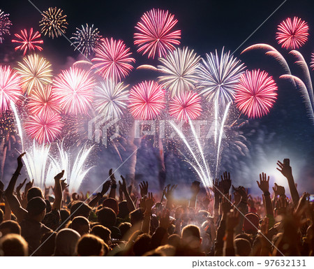 crowd watching fireworks on New Year eve 97632131