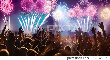 crowd watching fireworks on New Year eve crowd watching fireworks on New Year eve 97632134
