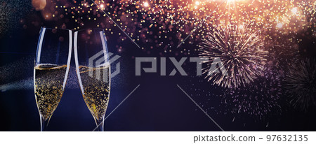 new year background with champagne glasses and fireworks new year background with champagne glasses and fireworks 97632135
