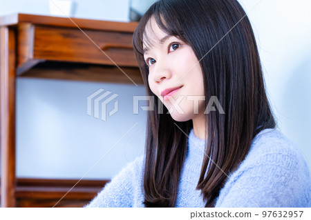 A knitted woman who relaxes leisurely A knitted woman who relaxes leisurely 97632957