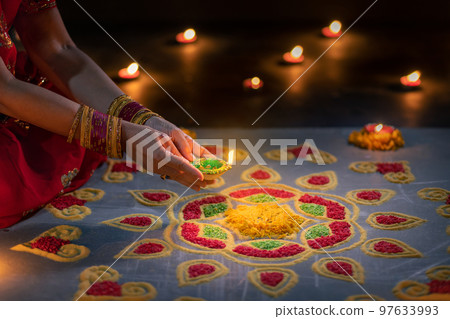 Happy Diwali - Diya lamps lit during diwali celebration 97633993