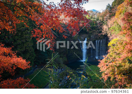 Autumn colors make the waterfalls in the forest Japan 97634361