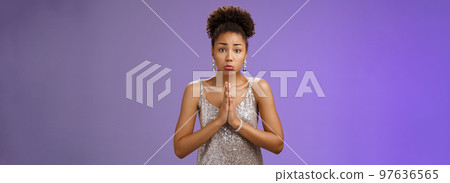 Attractive african-american woman in glittering silver evening dress begging friend favour look dearly pouting frowning silly face asking please give me money lend outfit, blue background Attractive african-american woman in glittering silver evening dress begging friend favour look dearly pouting frowning silly face asking please give me money lend outfit, blue background 97636565