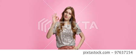 Not bad, you good. Portrait impressed glamour cheeky girlfriend smirking satisfied show okay ok gesture tilting head checking out your outfit pleased, standing confident pink background Not bad, you good. Portrait impressed glamour cheeky girlfriend smirking satisfied show okay ok gesture tilting head checking out your outfit pleased, standing confident pink background 97637154