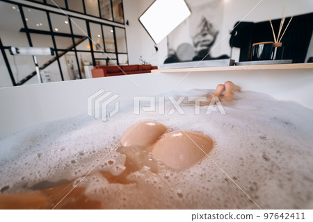 Female buttocks closeup in bath 97642411