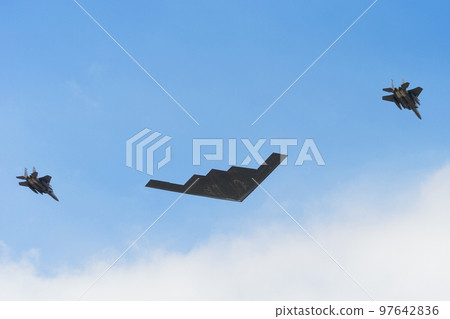 United States Air Force B-2 stealth bomber and escort F-15 fighter 97642836