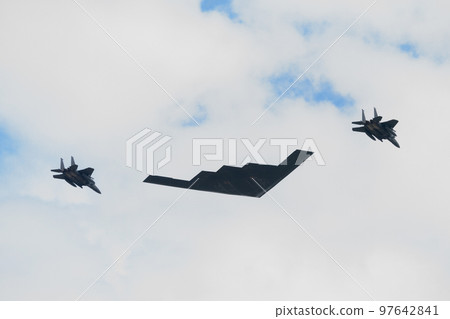 United States Air Force B-2 stealth bomber and escort F-15 fighter 97642841