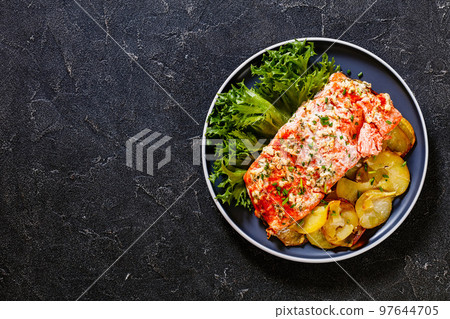 salmon with potato and tarragon sour cream sauce salmon with potato and tarragon sour cream sauce 97644705