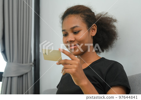 Closeup woman hand holding a credit card for financial transactions. Finance, loan, savings concept Closeup woman hand holding a credit card for financial transactions. Finance, loan, savings concept 97644841