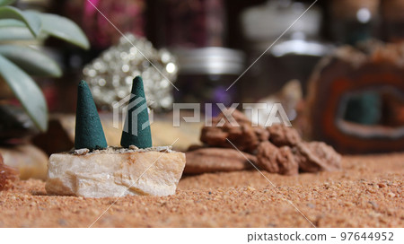 Aragonite Crystals With Incense Cones on Australian Red Sand 97644952