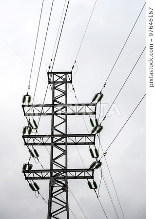 Power pole with garlands of insulators and wires 97646167