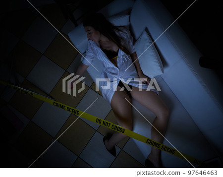 young woman lying dead on the couch after rape 97646463