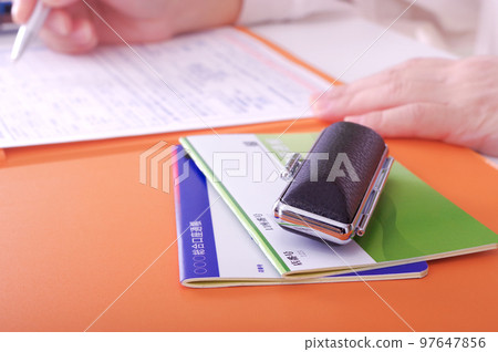 The hand of the person signing the contract The hand of the person signing the contract 97647856