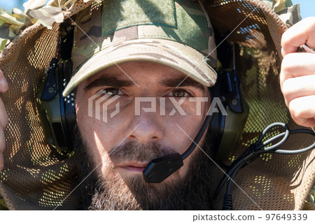 Special operations soldiers team preparing tactical and communication gear for action battle. Long distance sniper team in checking gear for action Special operations soldiers team preparing tactical and communication gear for action battle. Long distance sniper team in checking gear for action 97649339