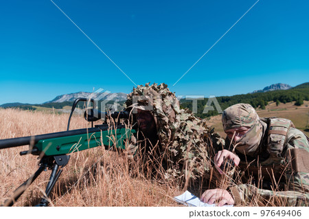 Sniper soldier assisted by an assistant to observe the area to be targeted with modern warfare tactical virtual reality goggles aerial drone military technology Sniper soldier assisted by an assistant to observe the area to be targeted with modern warfare tactical virtual reality goggles aerial drone military technology 97649406