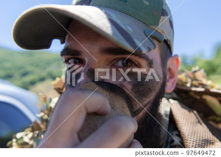 Special operations soldiers team preparing tactical and communication gear for action battle. Long distance sniper team in checking gear for action 97649472