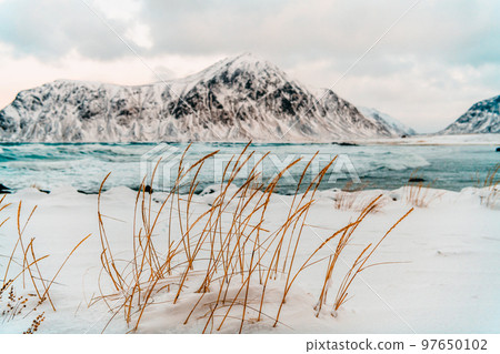 Norway coast in winter with snow bad cloudy weather 97650102