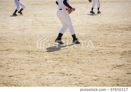 The feet of a boy practicing baseball 97650317