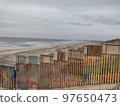 Gloomy View of Rusty Protective Border Wall Mexico Tijuana and United States 97650473