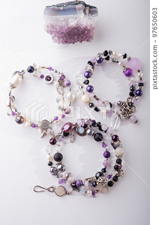 stylish jewelry bracelets with semiprecious and crystal at white background. hobby and fashion concept 97650603