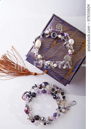 stylish jewelry semiprecious bracelets with present box around white background. hobby and fashion concept. stylish jewelry semiprecious bracelets with present box around white background. hobby and fashion concept. 97650604