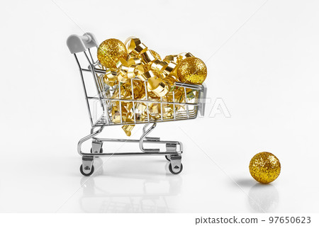 Full of Christmas decoration balls in miniature shopping cart as Christmas and new year season spending concept. 97650623