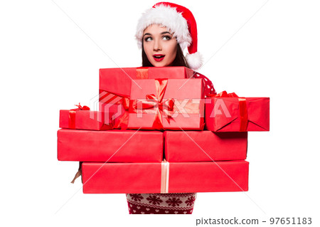 A beautiful young female overjoyed, holding many gifts in her hands A beautiful young female overjoyed, holding many gifts in her hands 97651183