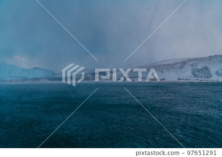 Norway coast in winter with snow bad cloudy weather 97651291