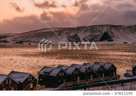 Traditional Norwegian fisherman's cabins and boats 97651295