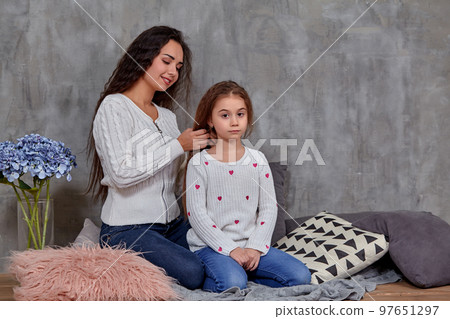 Eemotions of a beautiful young mother and her little daughter who spend time together 97651297