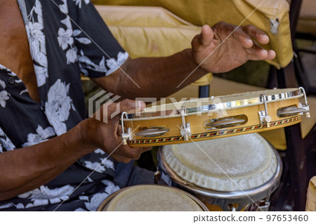 Musician playing tambourine in the streets of Pelourinho in Salvador Musician playing tambourine in the streets of Pelourinho in Salvador 97653460