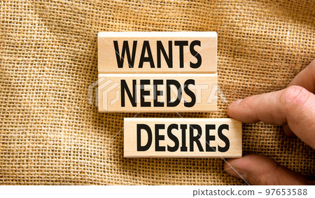 Wants needs and desires symbol. Concept words Wants Needs Desires on wooden blocks. Businessman hand. Beautiful canvas background. Business, psychological wants needs and desires concept. Copy space. Wants needs and desires symbol. Concept words Wants Needs Desires on wooden blocks. Businessman hand. Beautiful canvas background. Business, psychological wants needs and desires concept. Copy space. 97653588
