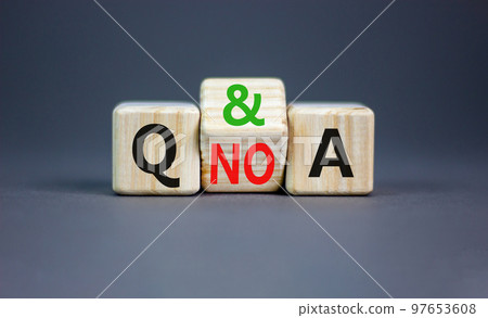 Q and A question and answer symbol. Concept word Q and A or Q no A on wooden cubes. Beautiful grey table grey background. Business Q and A question and answer concept. Copy space. 97653608