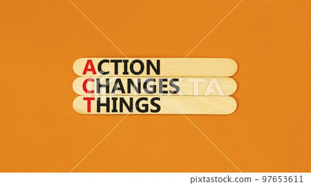 ACT action changes things symbol. Concept words ACT action changes things on wooden sticks on a beautiful orange table orange background. Business and ACT action changes things concept. Copy space. ACT action changes things symbol. Concept words ACT action changes things on wooden sticks on a beautiful orange table orange background. Business and ACT action changes things concept. Copy space. 97653611