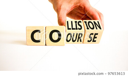 Collision course symbol. Concept word Collision course on wooden cubes. Beautiful white table white background. Businessman hand. Business collision course concept. Copy space. Collision course symbol. Concept word Collision course on wooden cubes. Beautiful white table white background. Businessman hand. Business collision course concept. Copy space. 97653613