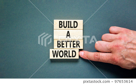 Build a better world symbol. Concept words Build a better world on wooden cubes. Beautiful grey table grey background. Businessman hand. Business build a better world concept. Copy space. Build a better world symbol. Concept words Build a better world on wooden cubes. Beautiful grey table grey background. Businessman hand. Business build a better world concept. Copy space. 97653614