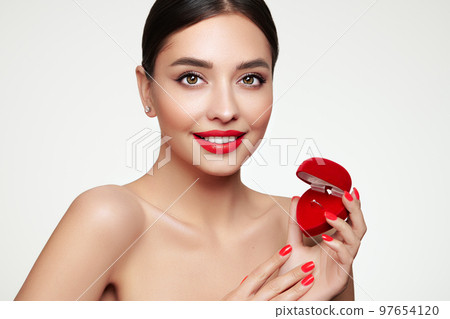 Young beautiful woman with wedding ring gift 97654120