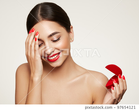 Young beautiful woman with wedding ring gift 97654121