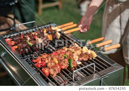 Barbeque skewers meat with vegetable grilling on charcoal bbq grill in backyard 97654295