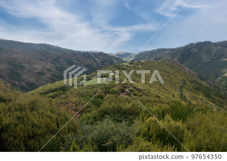 Beautiful view of the mountains on the island. Green mountain valley. Beautiful view of the mountains on the island. Green mountain valley. 97654350