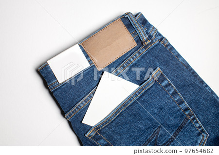 An empty note in the pocket of jeans An empty note in the pocket of jeans 97654682