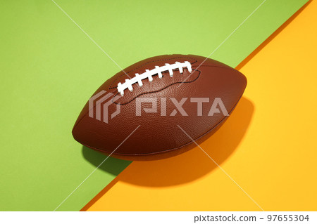 American football ball on two tone background American football ball on two tone background 97655304