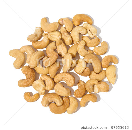 Heap of roasted cashew nut on white isolated background 97655613