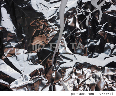 Crumpled gray foil sheet for food packaging, full frame Crumpled gray foil sheet for food packaging, full frame 97655641