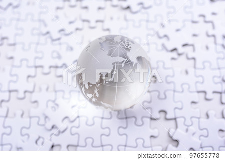 A globe on top of a disjointed jigsaw puzzle standard color 97655778