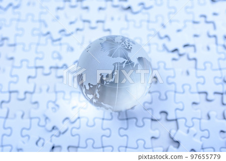 A globe on top of a disjointed jigsaw puzzle Cold color 97655779