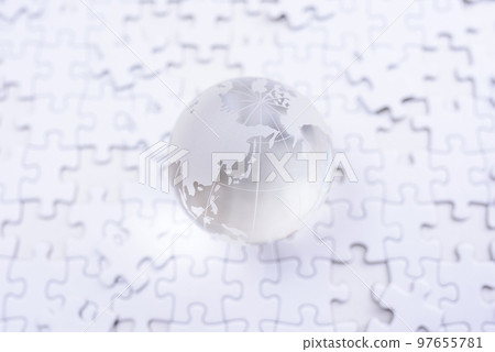 The globe on top of the disjointed jigsaw puzzle Bright The globe on top of the disjointed jigsaw puzzle Bright 97655781