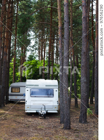 Camping trailers in the forest. Camping trailers in the forest. 97656290