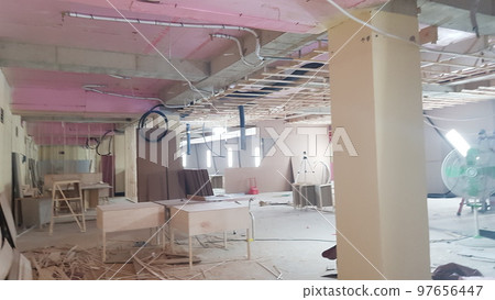 Indoor golf course construction. Interior. People. Structure. Wall. Wood. Carpentry Indoor golf course construction. Interior. People. Structure. Wall. Wood. Carpentry 97656447